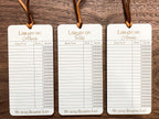 This bookmark features a library checkout card design, complete with a suede string detail for a stylish touch. (listing is for one bookmark)