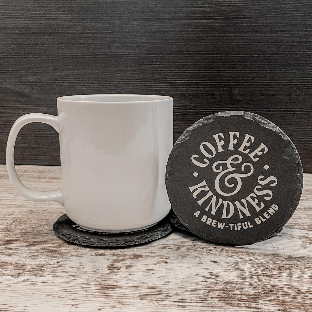 Coffee and Kindness a brew-tiful blend engraved on round slate coasters, set of 4