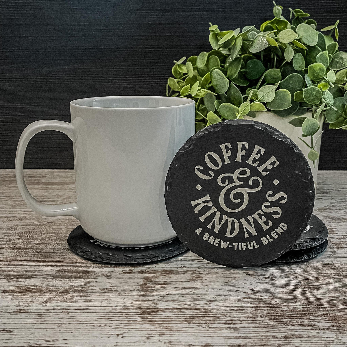 Coffee and Kindness a brew-tiful blend engraved on round slate coasters, set of 4