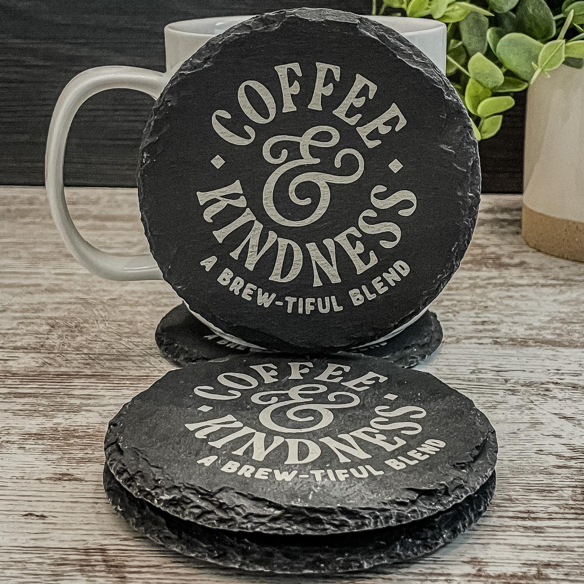 Coffee and Kindness a brew-tiful blend engraved on round slate coasters, set of 4