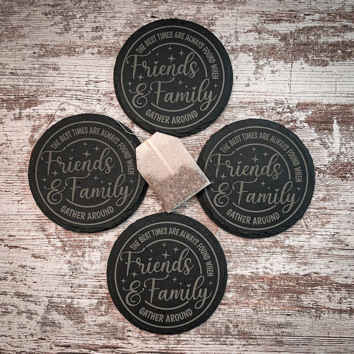 The best times are always found when friends and family gather round engraved on round slate coasters, set of 4