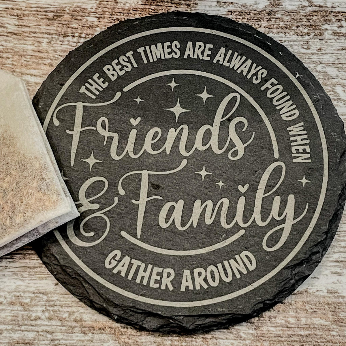 The best times are always found when friends and family gather round engraved on round slate coasters, set of 4