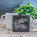Slate coasters with bass fish laser engraved on them in 4 different scenes.
