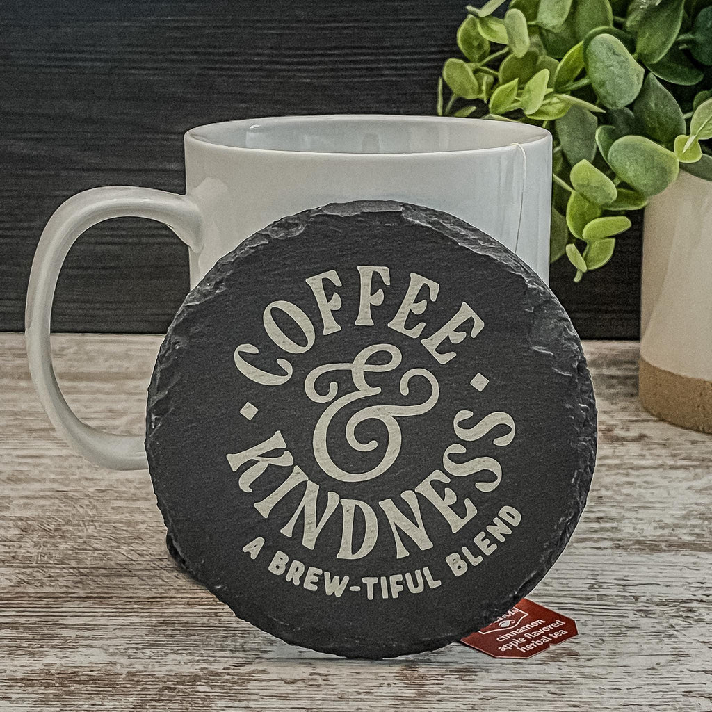 Coffee and Kindness a brew-tiful blend engraved on round slate coasters, set of 4