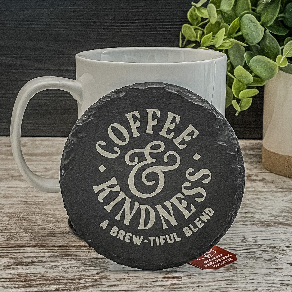 Coffee and Kindness a brew-tiful blend engraved on round slate coasters, set of 4
