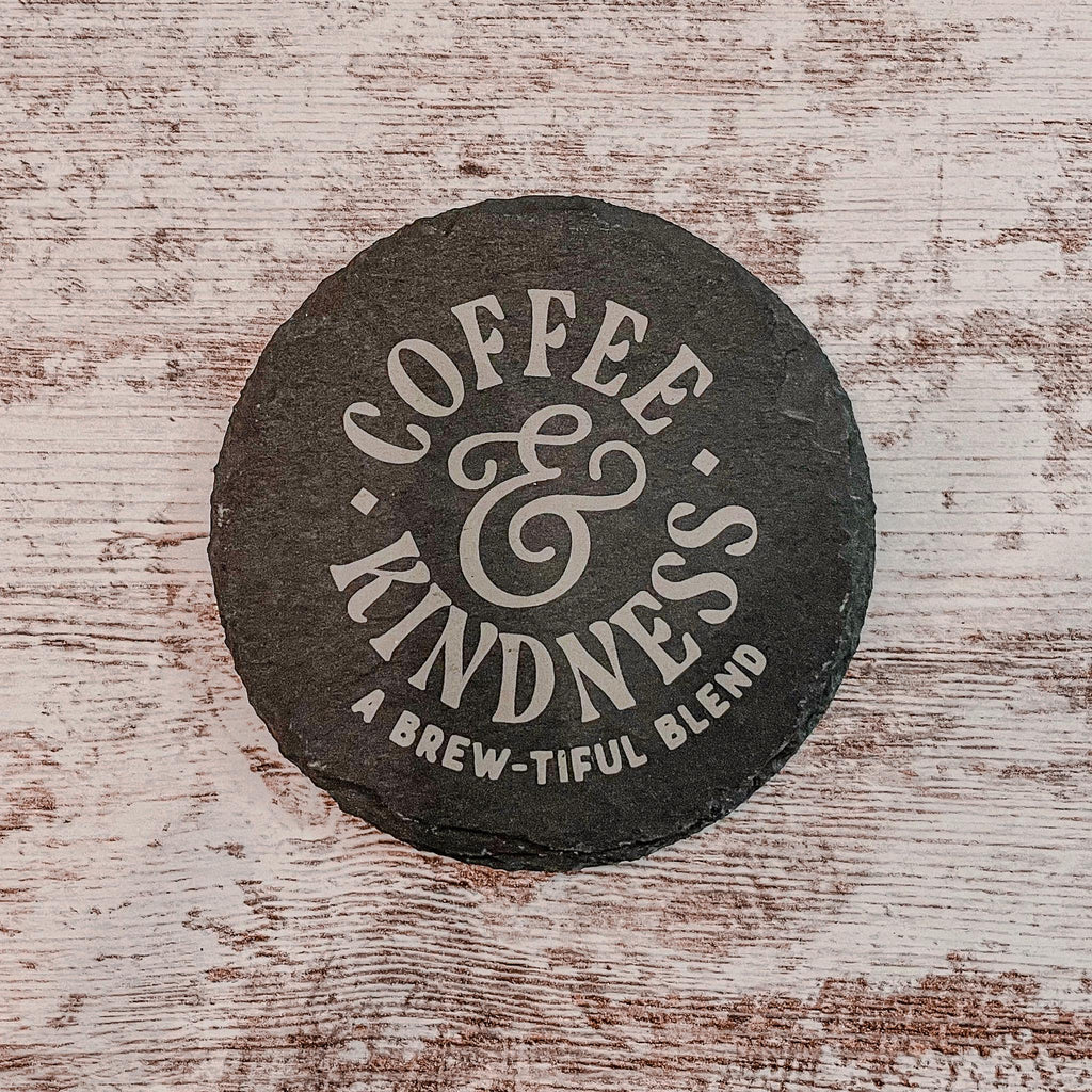 Coffee and Kindness a brew-tiful blend engraved on round slate coasters, set of 4
