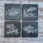 Slate coasters with bass fish laser engraved on them in 4 different scenes.